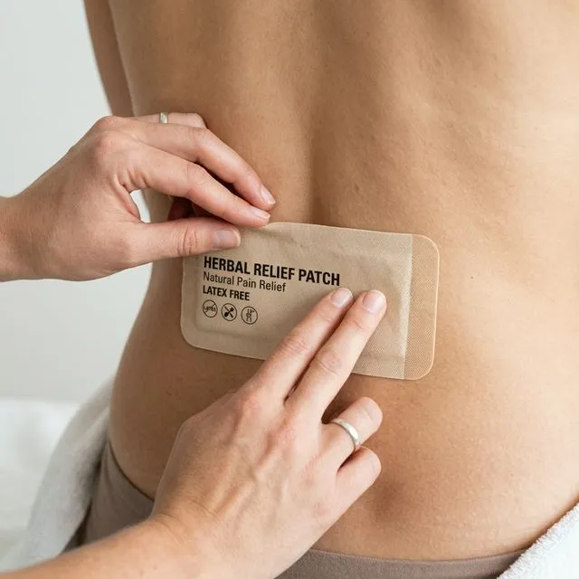 Herbal pain relief patch applied to lower back